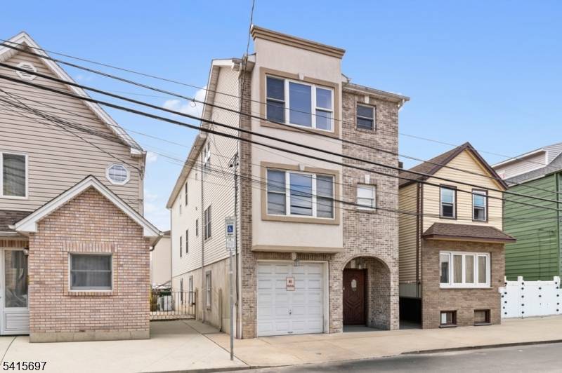 Welcome to 46 Barbara St in Newark, a solid two family home with 6 bedrooms and 4.