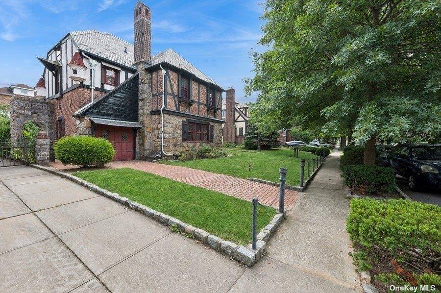This stunning Normandy Tudor style home has fairytale vibe !