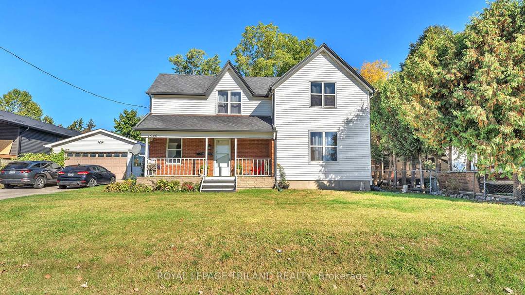 Fantastic Duplex with Development Potential sits on a large 80x150 ft lot with an oversized two car garage !