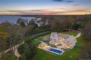 Down a gated drive along the most desirable stretch of coveted Beachside Avenue, this custom modern oasis offers the best of Gold Coast living.