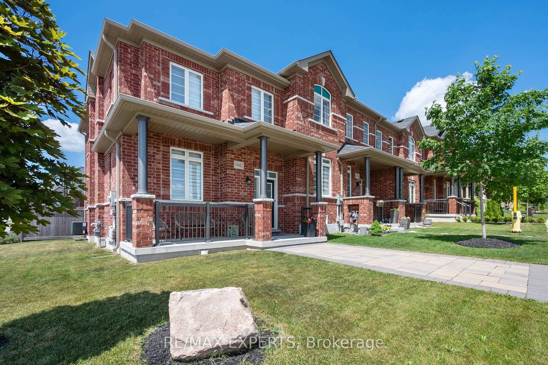End unit Townhome with Full Sized 2 Car Garage with 2 More Car Parking in Driveway.