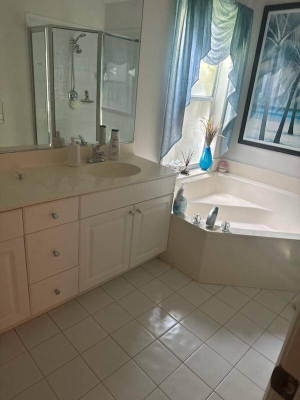 Beautifully maintained, light, bright and cheerful 2 2 plus den, Florida room, and 2 car attached garage.