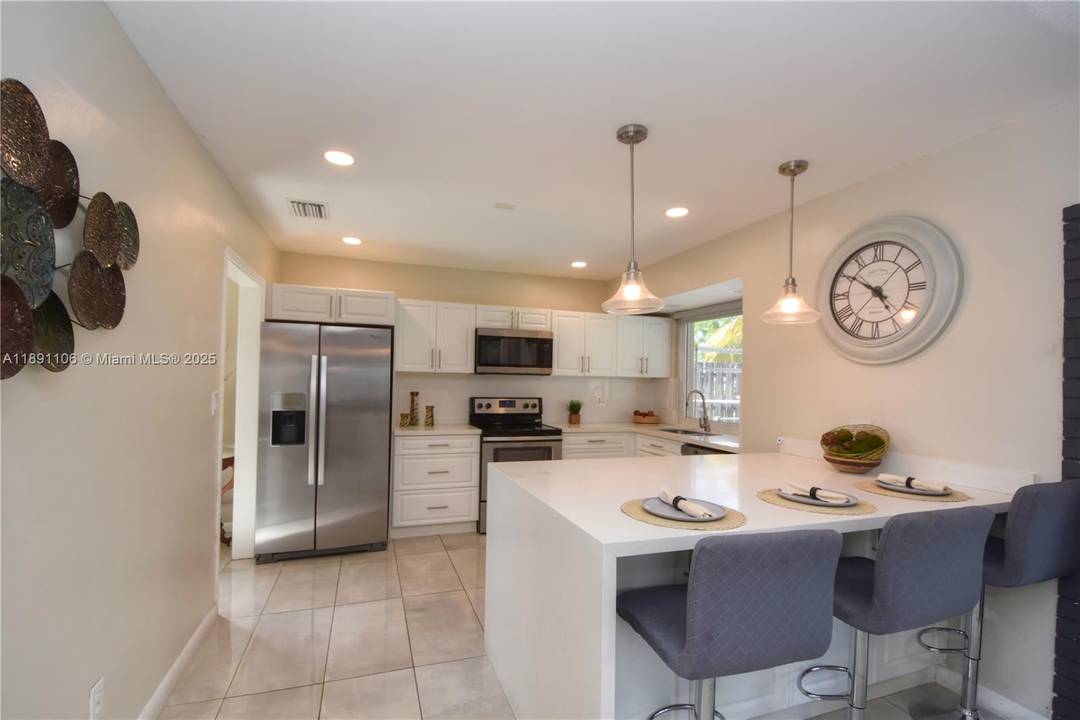 Welcome home ! This beautiful 3 bedroom 3 bath pool home is filled with natural light and modern touches throughout.