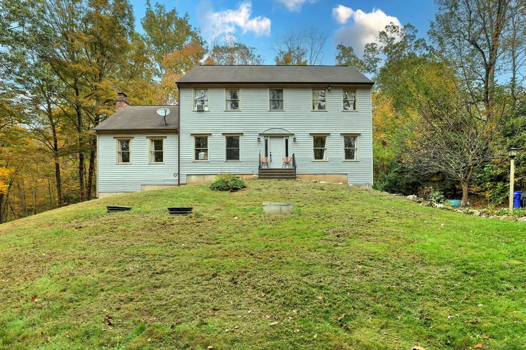 Beautiful Colonial style home set back on 7.