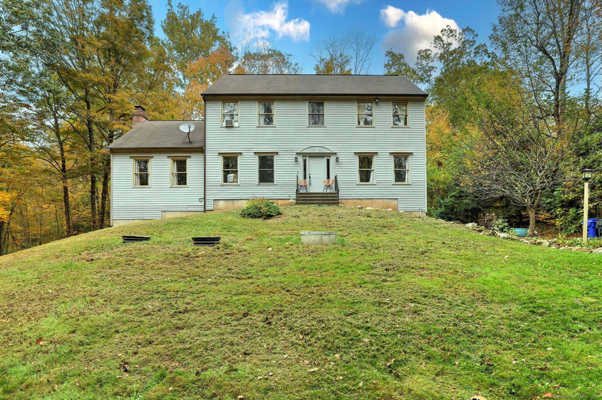 Beautiful Colonial style home set back on 7.
