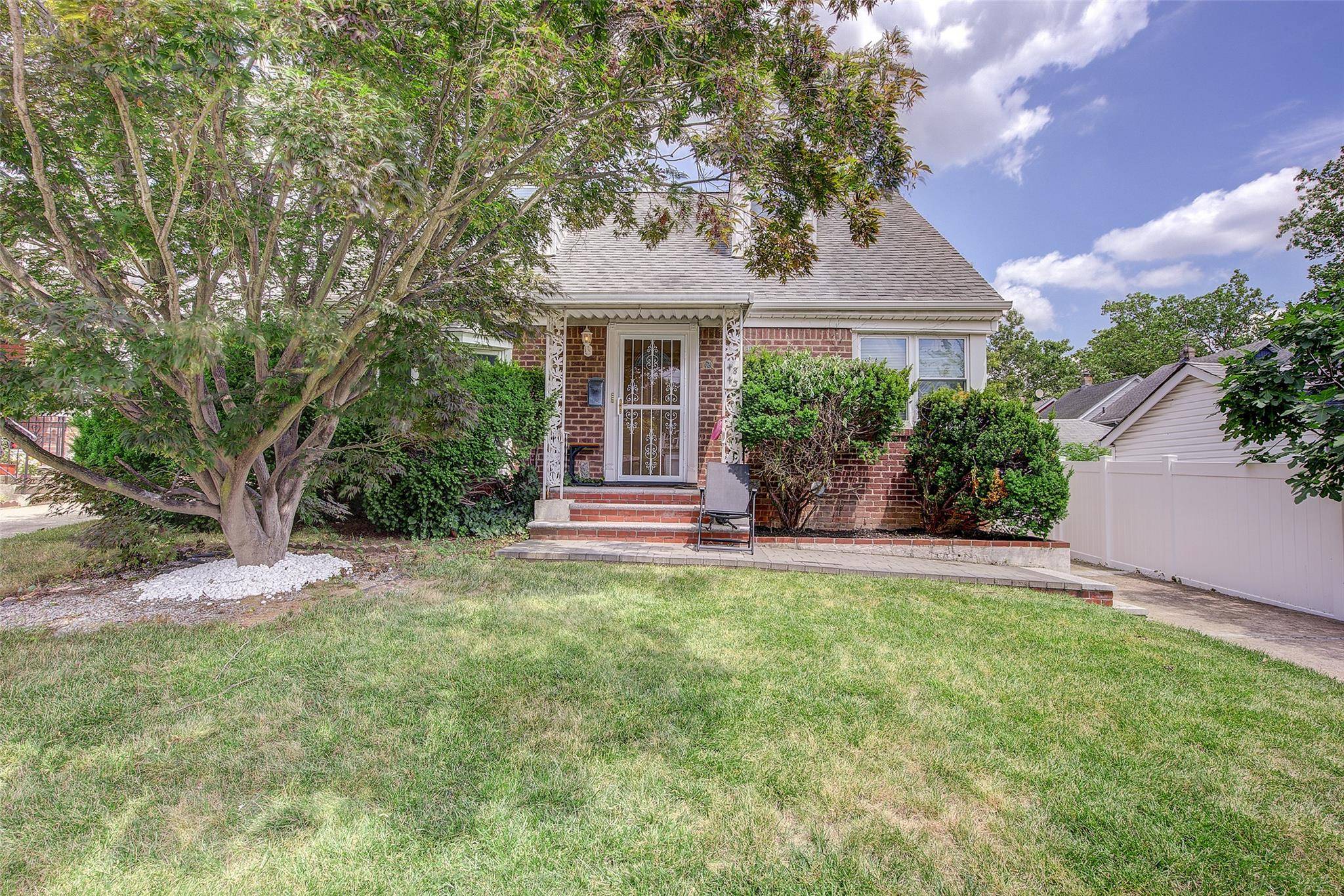 Imagine coming home to this detached two family Cape Cod home with a beautiful backyard garden perfect for entertaining.