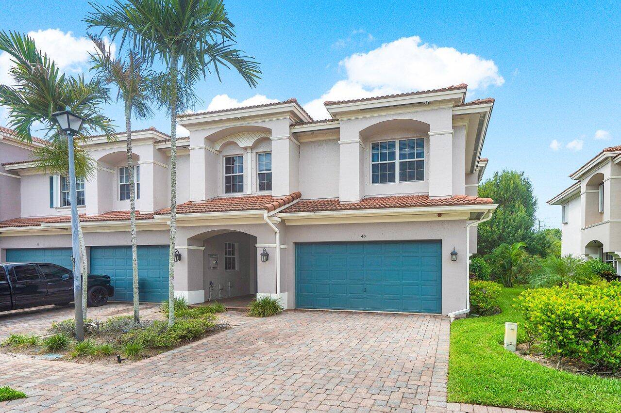 Welcome to this stunning corner unit townhouse, perfectly nestled in the desirable Carriage Pointe community.