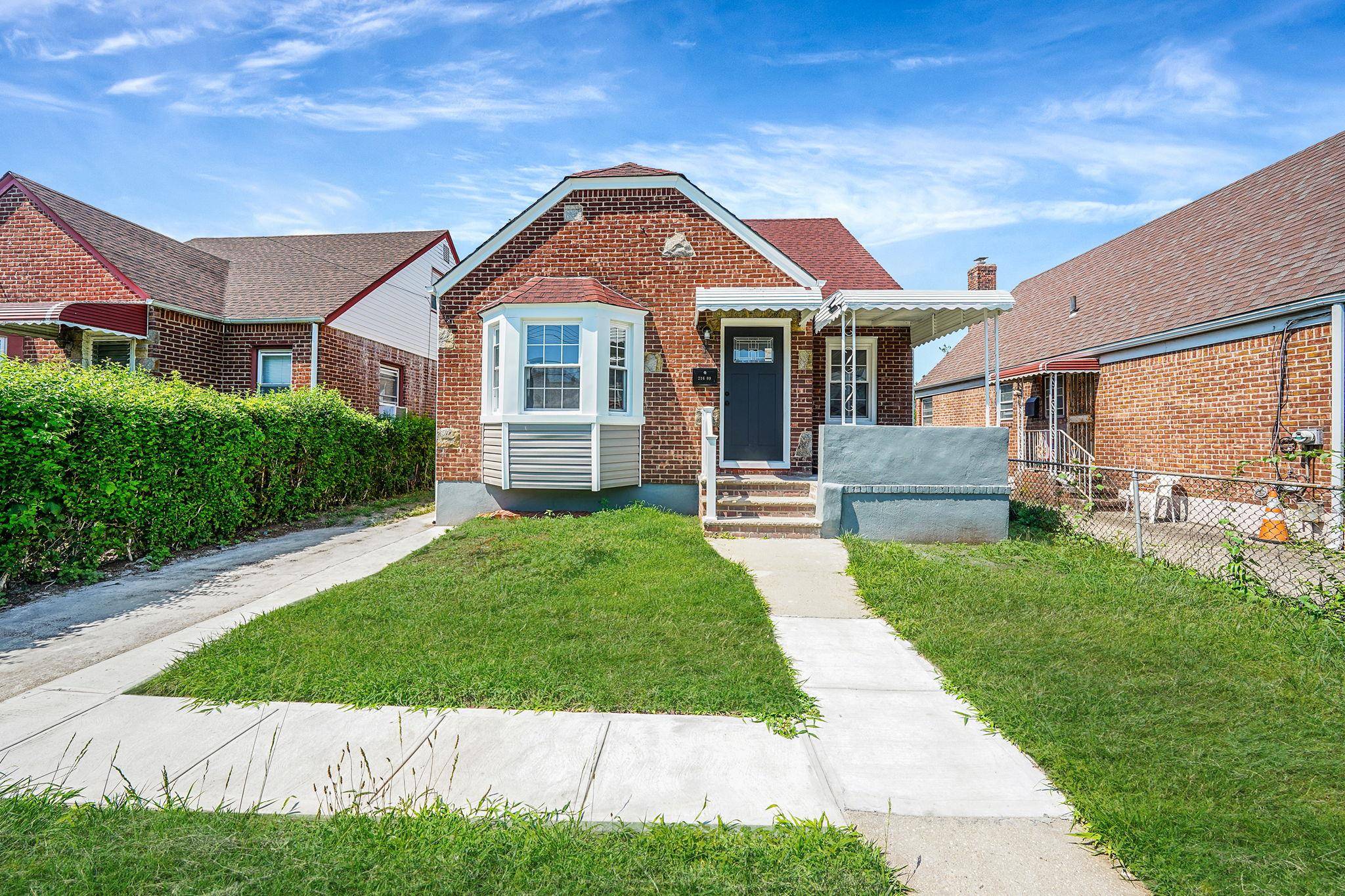 Welcome to 216 09 104th Avenue a beautifully renovated single family home.