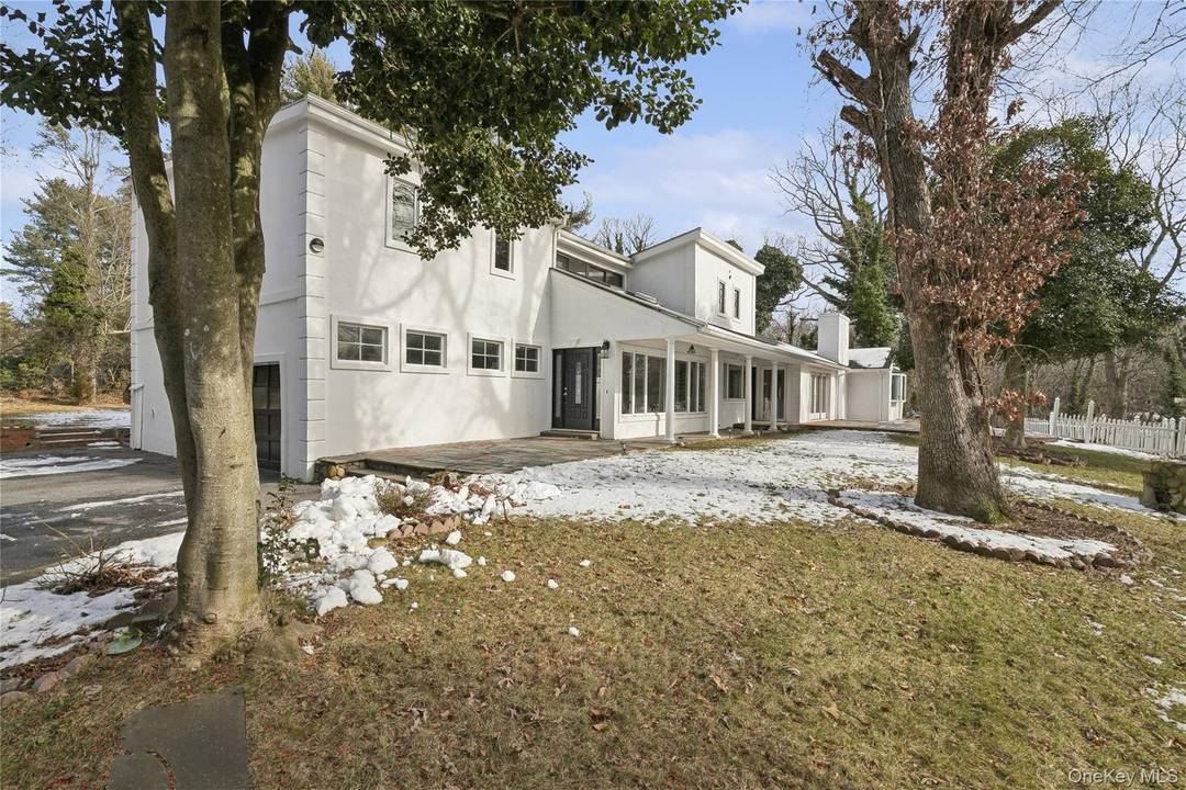 Contemporary style home offering approximately 5, 040 square feet of living space set on a 1.