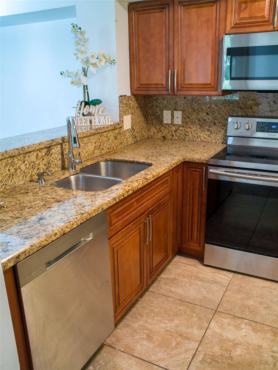 3 bedroom, 2 bath condo with lake views, located directly in front of the tennis and pickleball courts in a resort style community.