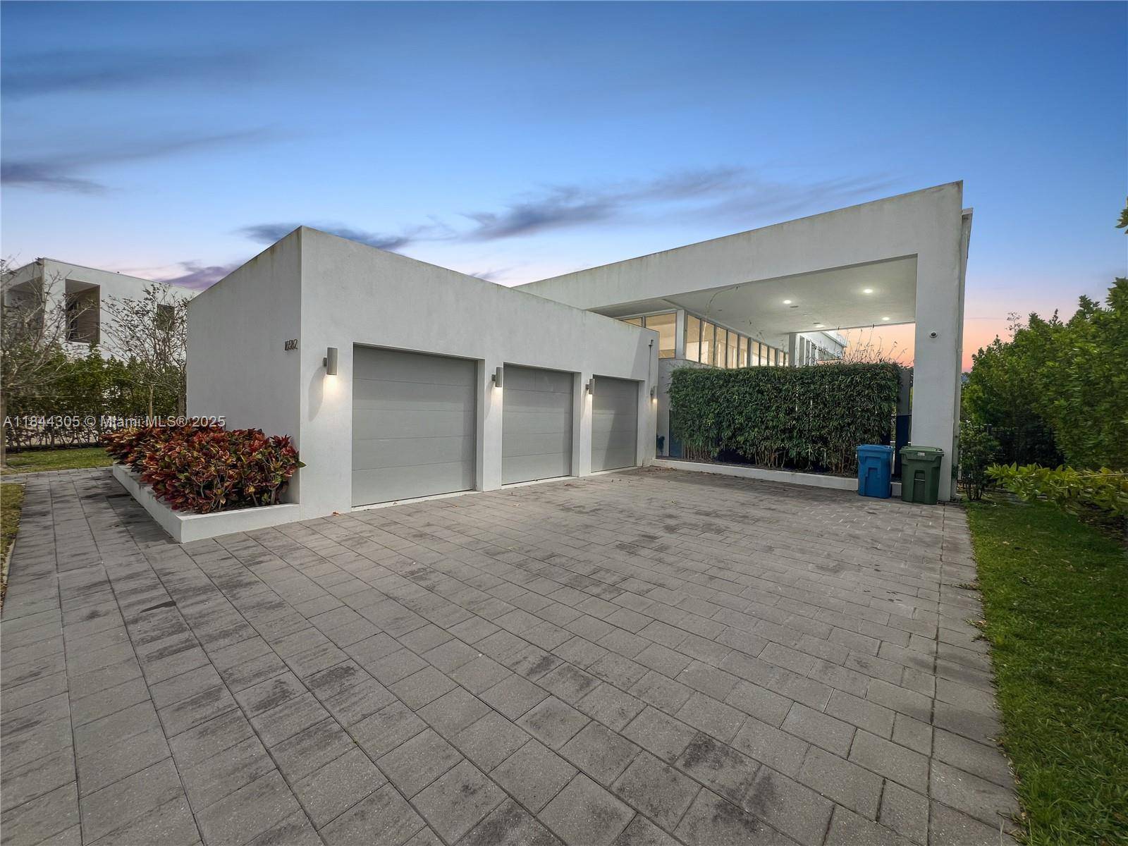 Live in luxury in this spectacular single story residence located in the exclusive gated community of Botaniko Weston.