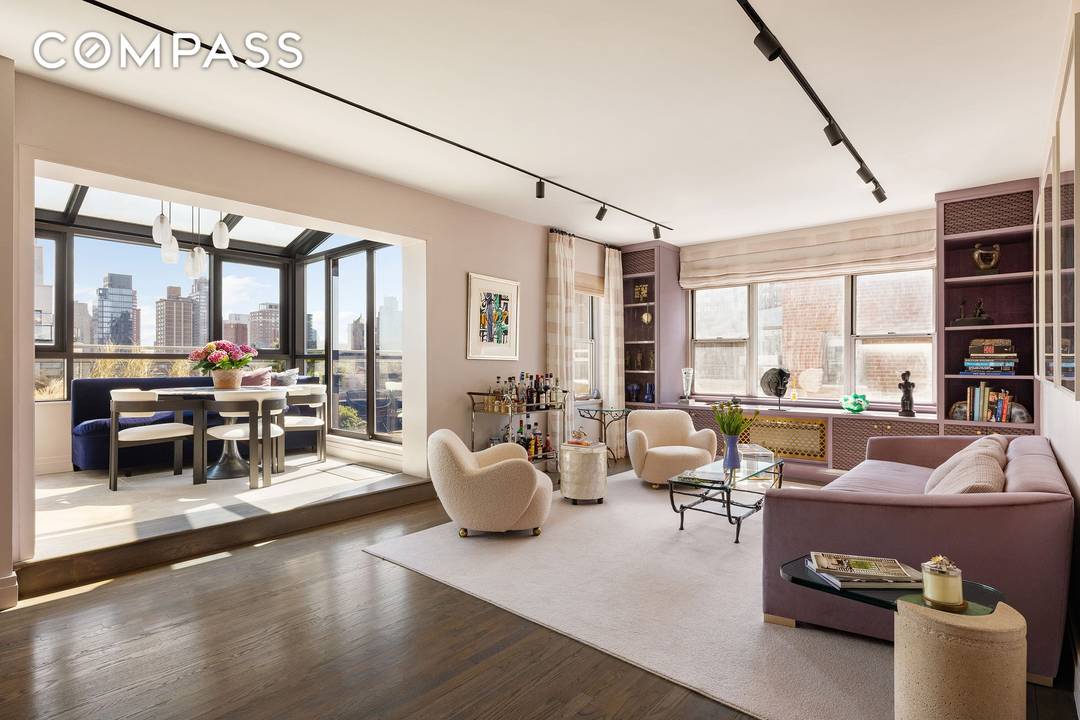 CHIC, SOPHISTICATED PENTHOUSE with two private landscaped terraces and sweeping east and west skyline views.