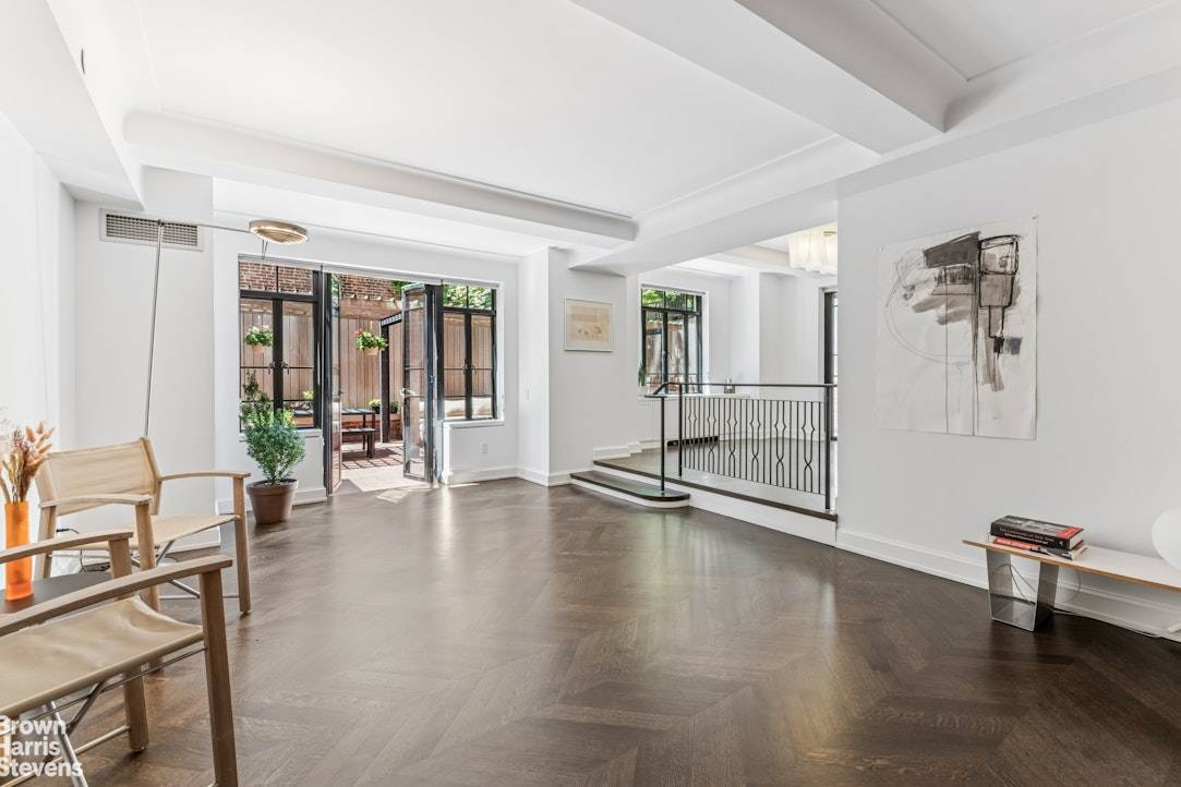 A Spectacular Garden Oasis in the Heart of Greenwich Village Welcome to a rare and unique home that combines townhouse charm with full service condo living.