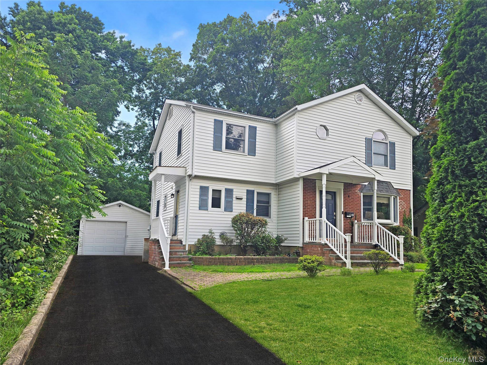 Discover this charming mid block Colonial home in the prestigious Roxbury area of Glen Cove, which has been recognized as one of the safest cities to live in the country.