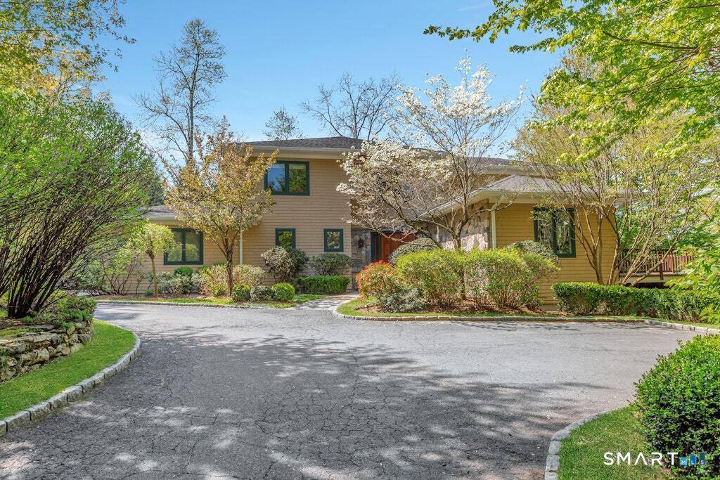 Experience refined luxury in this expansive Westover home, discreetly nestled at the end of a tranquil driveway just moments from schools, highways, transportation, and Stamford and Greenwich amenities.