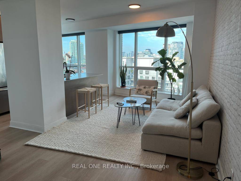 A Spacious Furnished 2 Bedroom Den, 2 Bath Corner Suite In A Luxury Building Located.