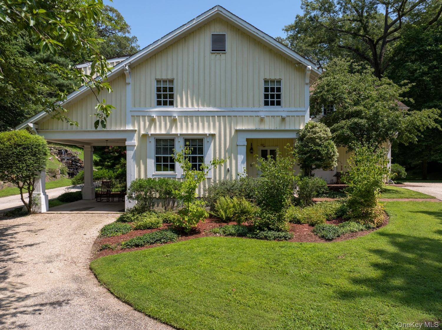 Restored Historic Carriage House with Guest Cottage in Prestigious Cove Neck.