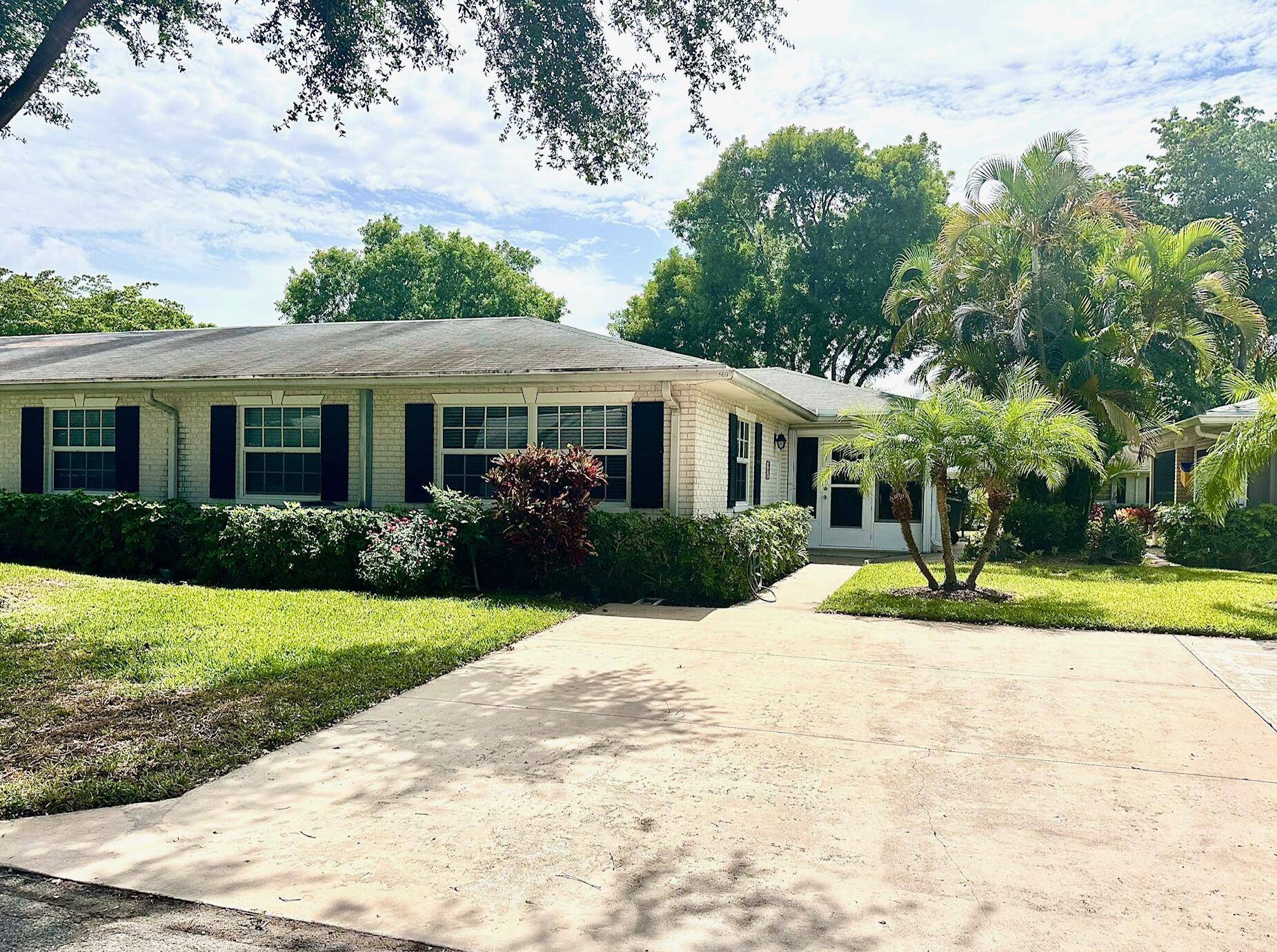 THIS CHARMING LIGHT BRIGHT, TURNKEY, CORNER VILLA IS NICELY UPGRADED RENOVATED.