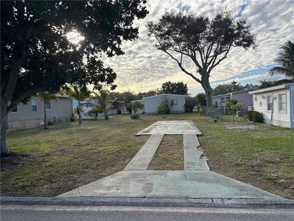 Nice, cleared lot in the renowned Barefoot Bay Manufactured home community.