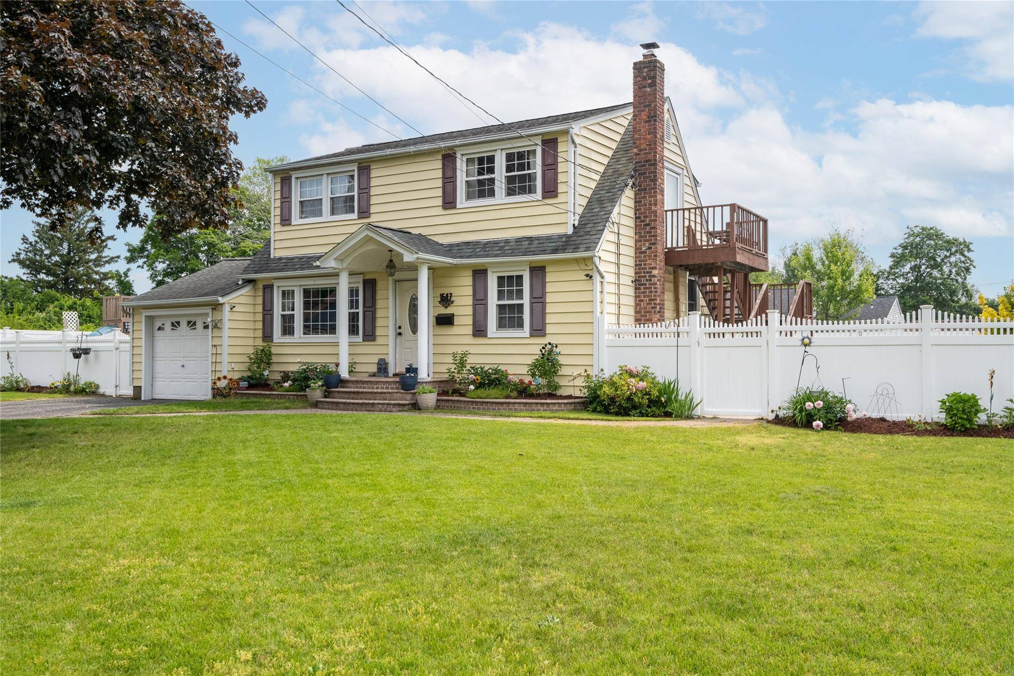 Welcome to this spacious and beautifully maintained Expanded Cape, ideally situated mid block in a quiet Brightwaters Farms neighborhood.