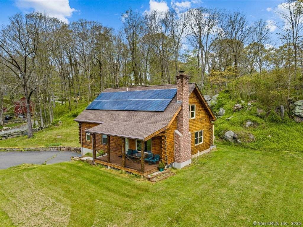 Welcome to 698 Leetes Island Road in Branford a rustic retreat full of warmth and charm !