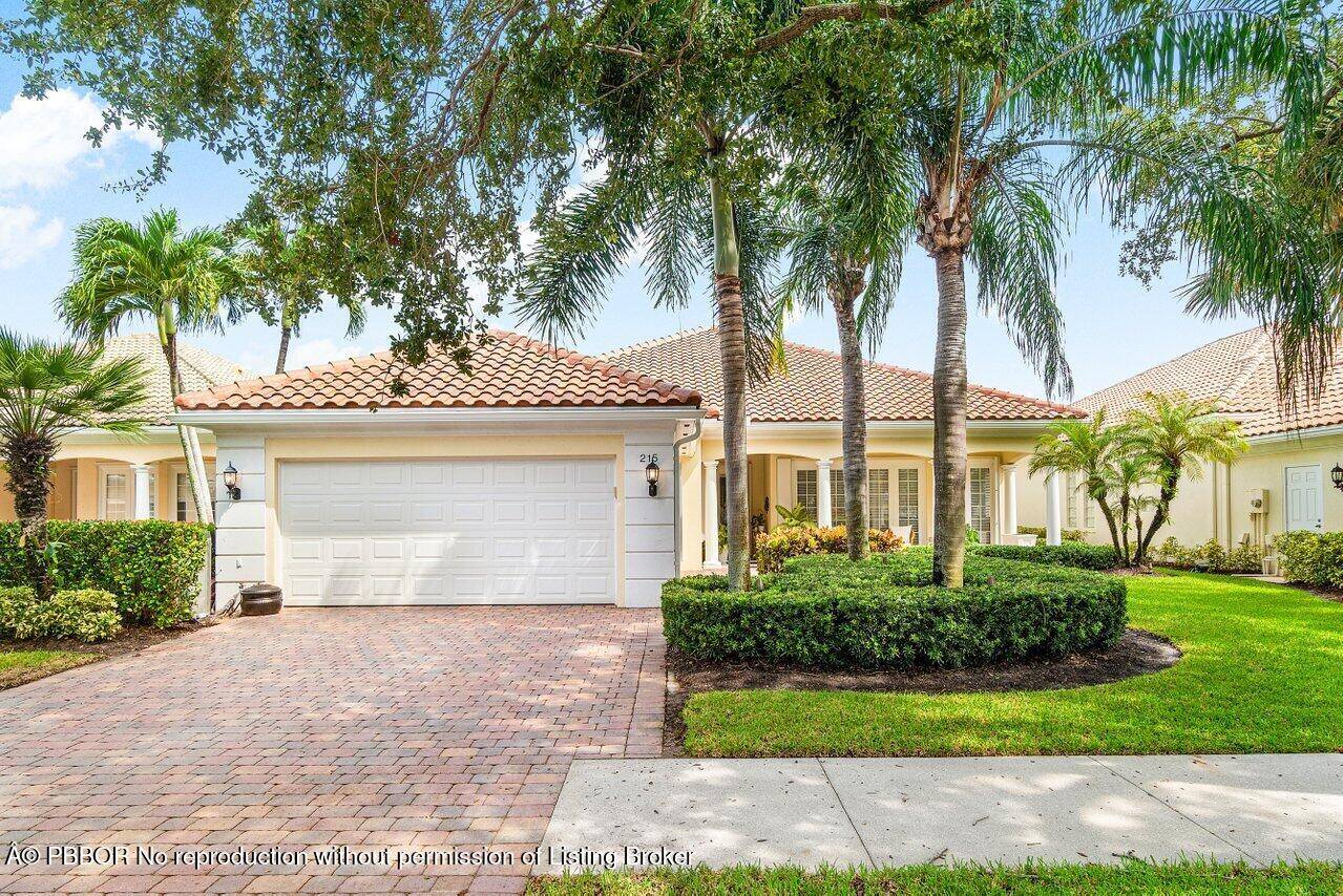 Enjoy peaceful lake views from this immaculately maintained Carlyle model, sited on a quiet cul de sac in the coveted Isles at Palm Beach Gardens.