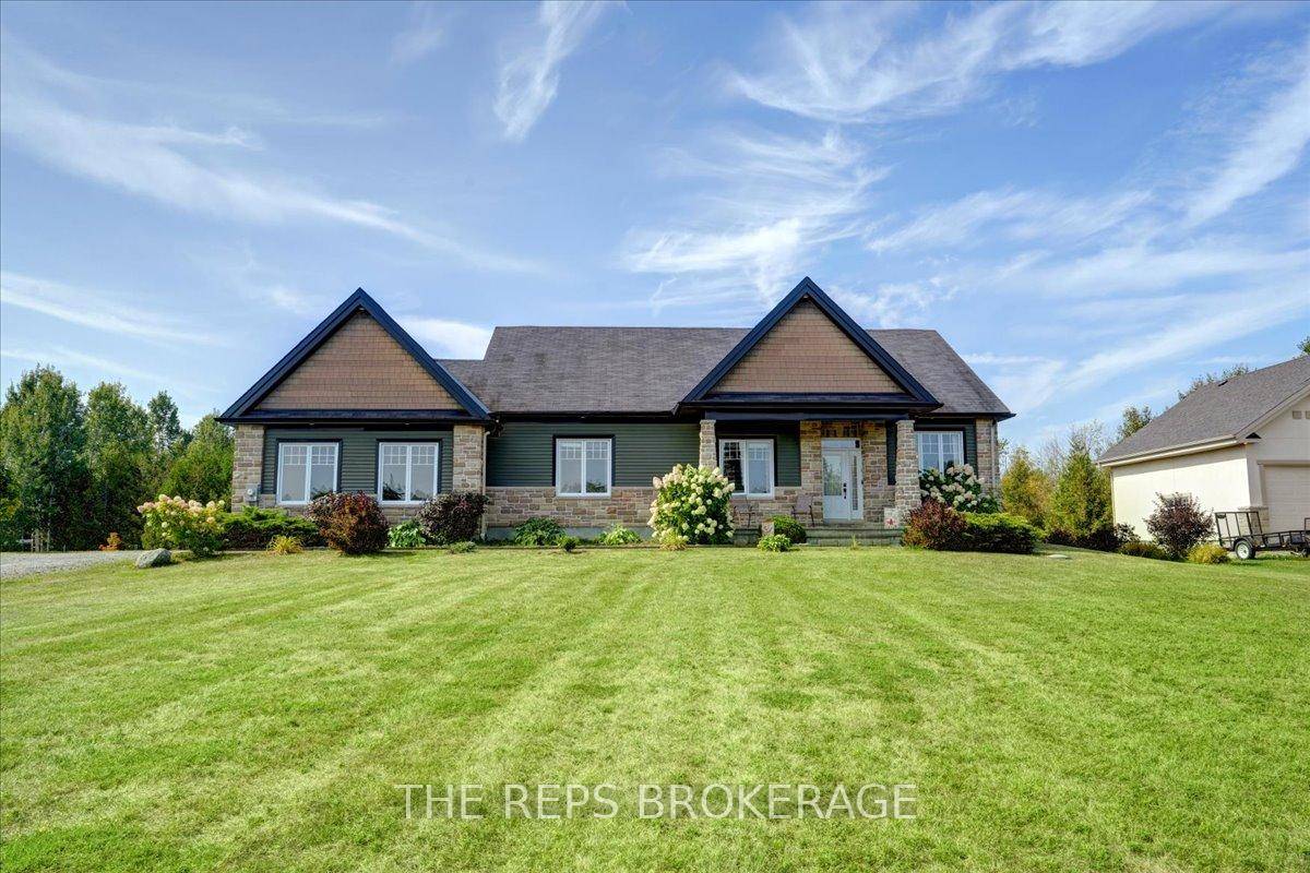 Welcome to 206 Country Lane, a true showpiece bungalow where luxury living meets country charm.