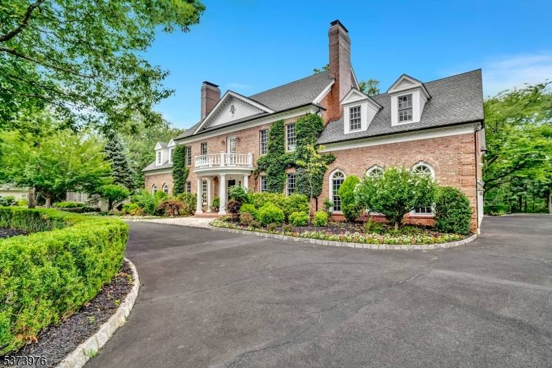 Experience timeless sophistication and unrivaled craftsmanship in this exceptional 5, 100 sq ft custom brick Georgian Colonial, perfectly situated in prestigious Warren Brook Estates.