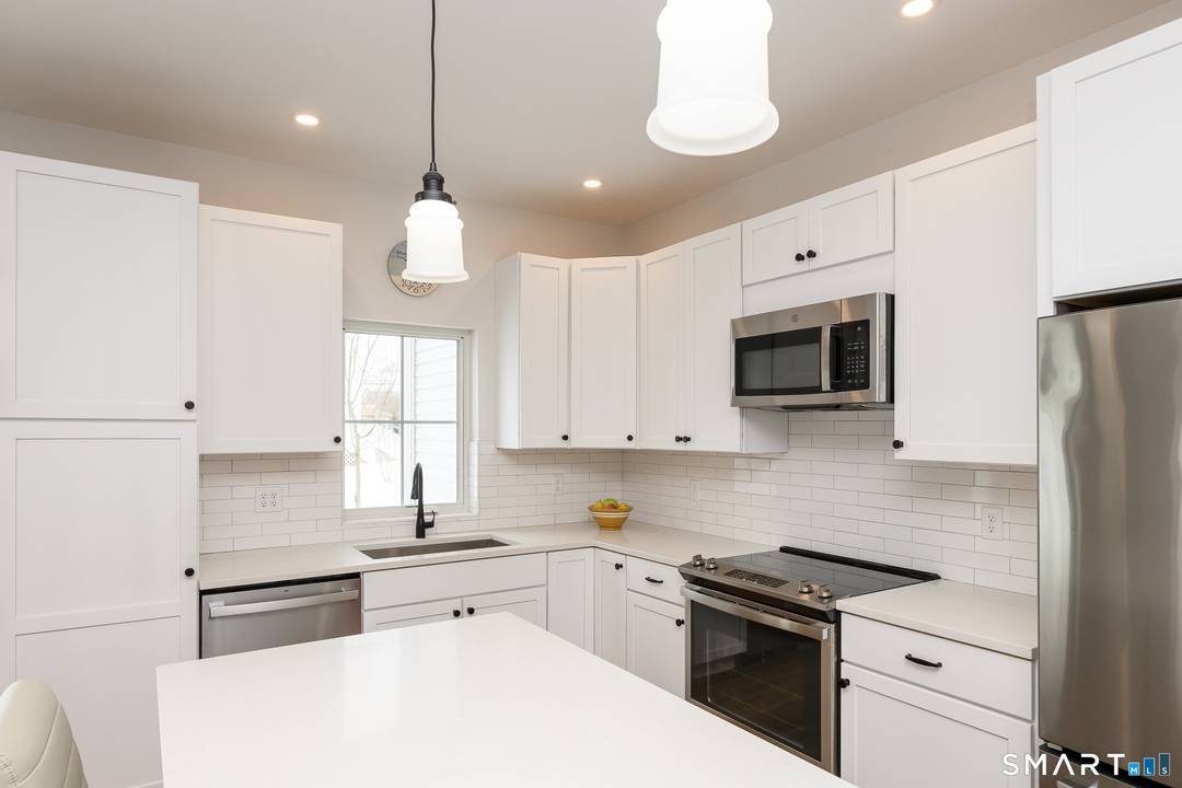 Rare end unit with a first floor primary bedroom in East Lyme's newest 55 community.