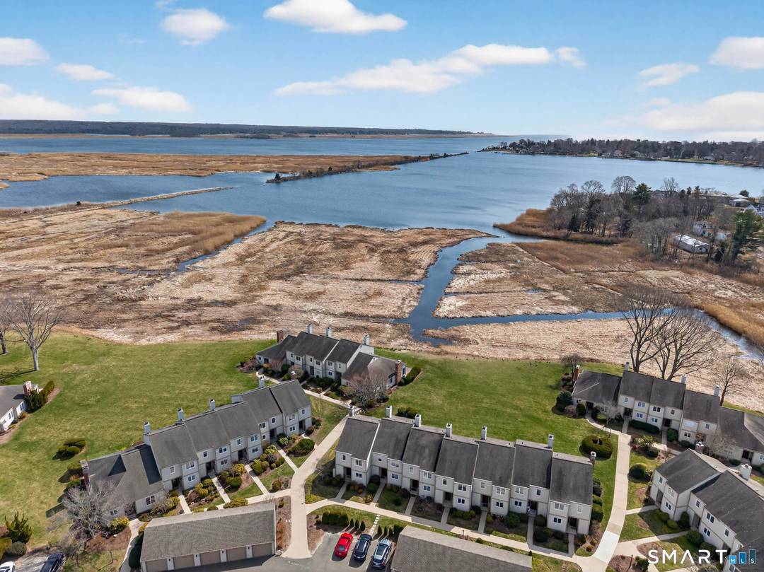 Enjoy effortless shoreline living with sweeping views of North Cove from this beautifully renovated, move in ready townhouse style condo in the heart of Old Saybrook.