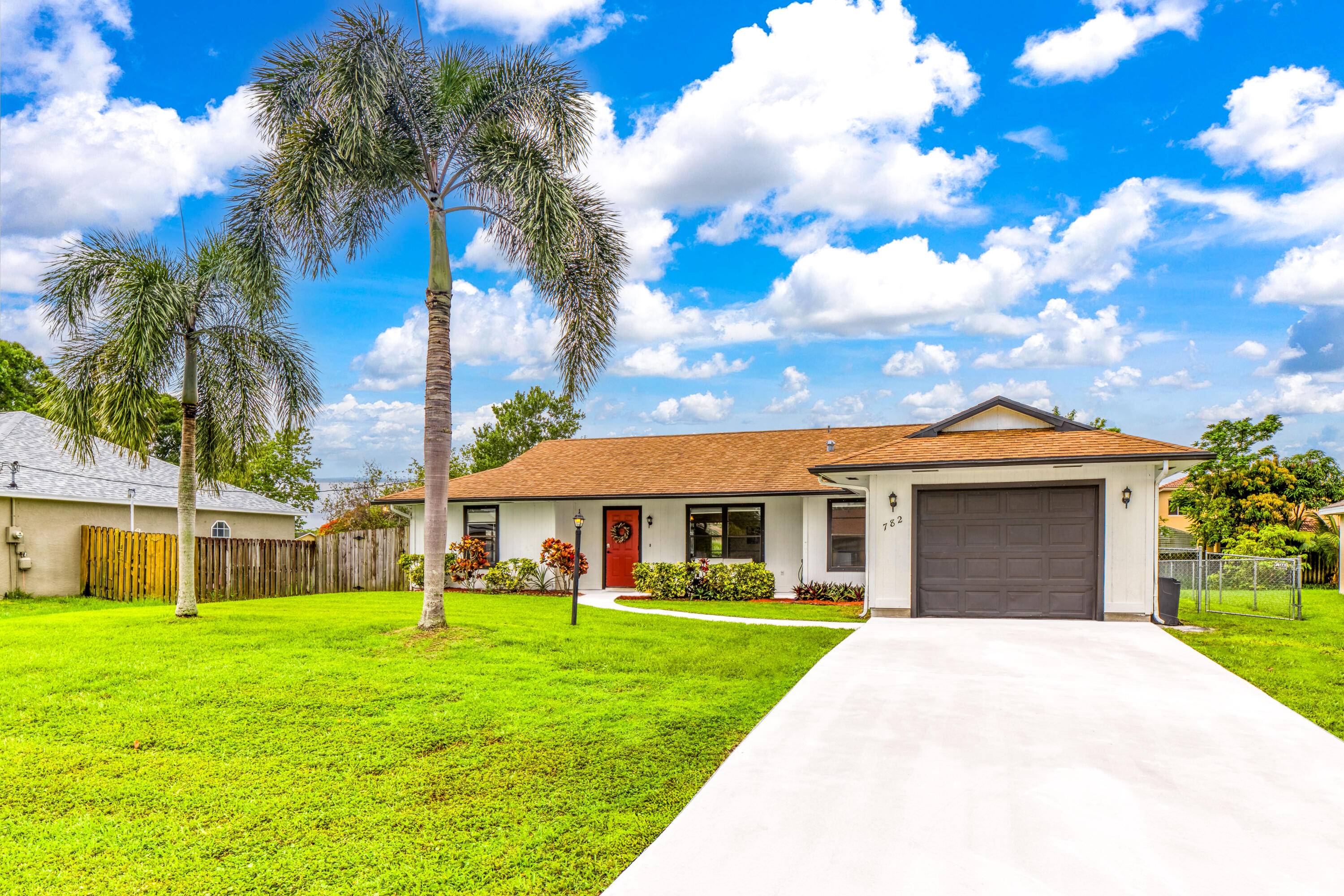 You owe it to yourself to see this delightful, sunny home with a BIG FENCED BACKYARD and SCREENED LANAI.
