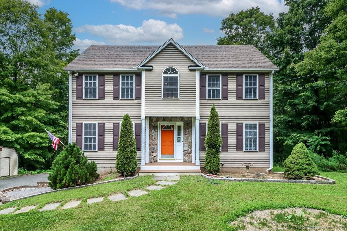 Spectacular marvelously maintained colonial perched high above quintessential downtown New Milford.