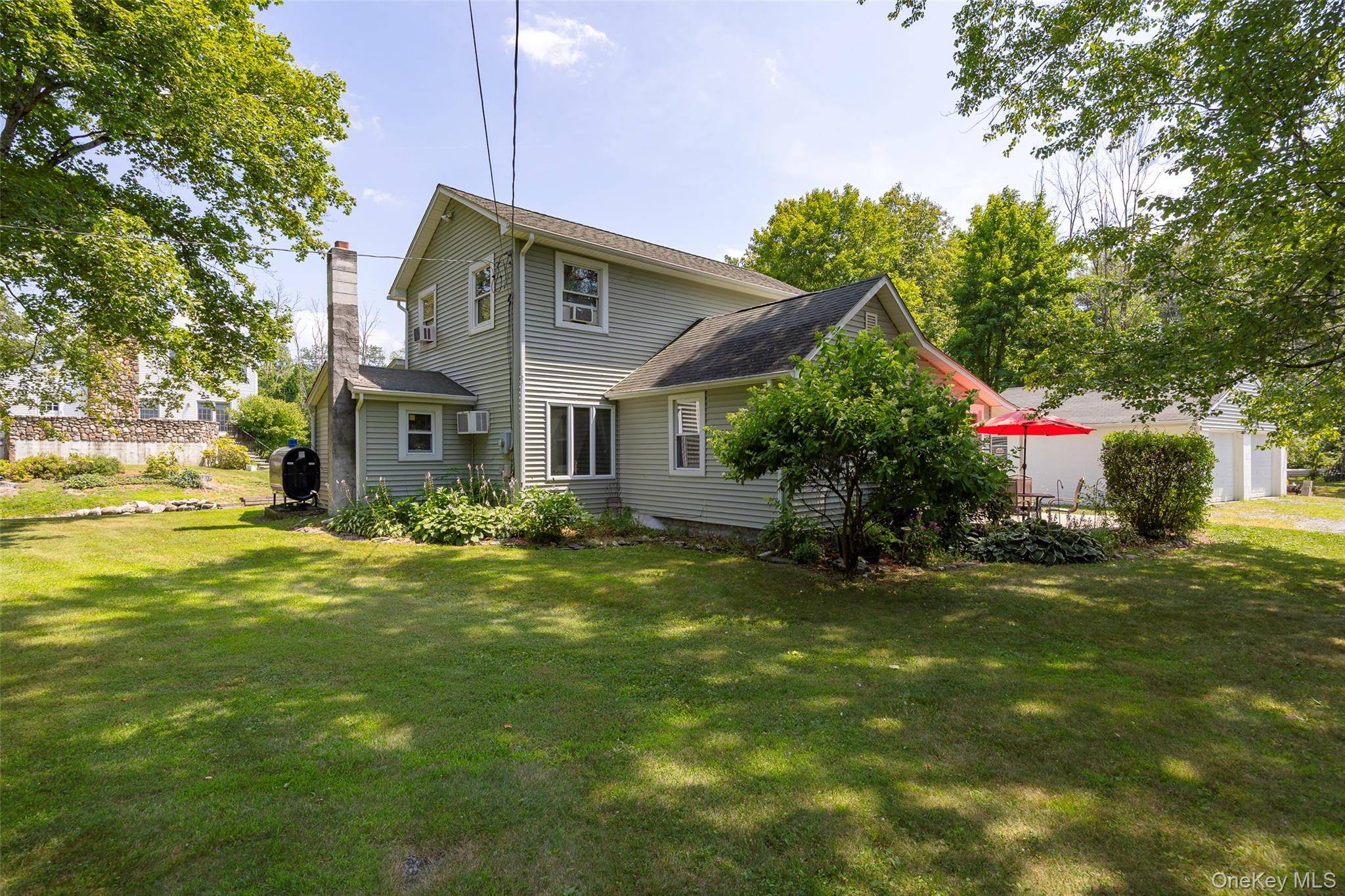 Welcome home to this charming Cape style home at 106 Skidmore Rd, La Grangeville, NY 12540 on Spout Creek with the Arlington School District.