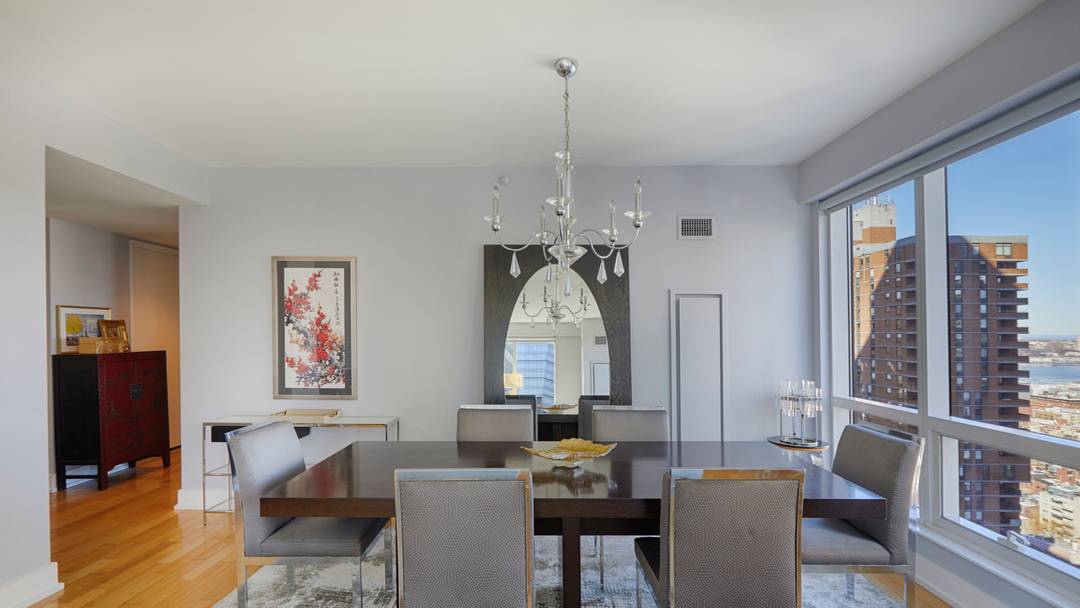 Welcome to a luxurious living experience at 350 West 42nd Street, Unit 34D, nestled in the vibrant neighborhood of Hells Kitchen.