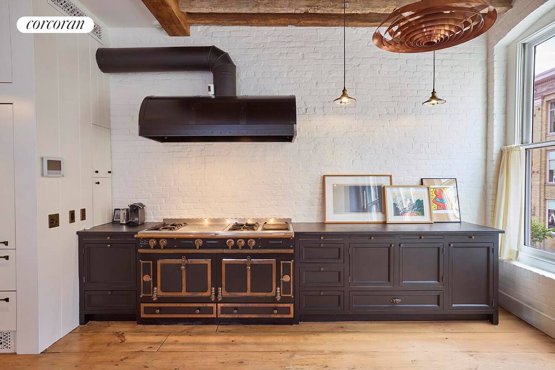 A SEAPORT LANDMARK TOWNHOUSE, REIMAGINED FOR CHIC MODERN LIVING !