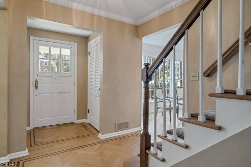 Located on a quiet tree lined street in the desirable Tall Oaks section of New Providence, this beautifully maintained 4 BR, 2.