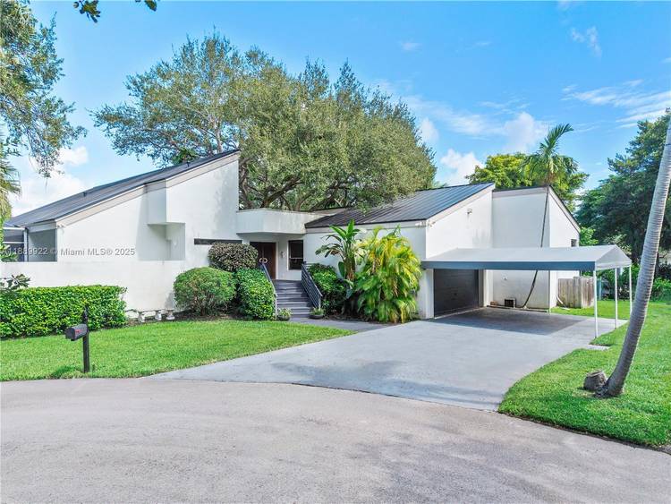 Mid century modern 4BR 3BA loft residence in Palmetto Bay, designed by architect Marc Firestone.