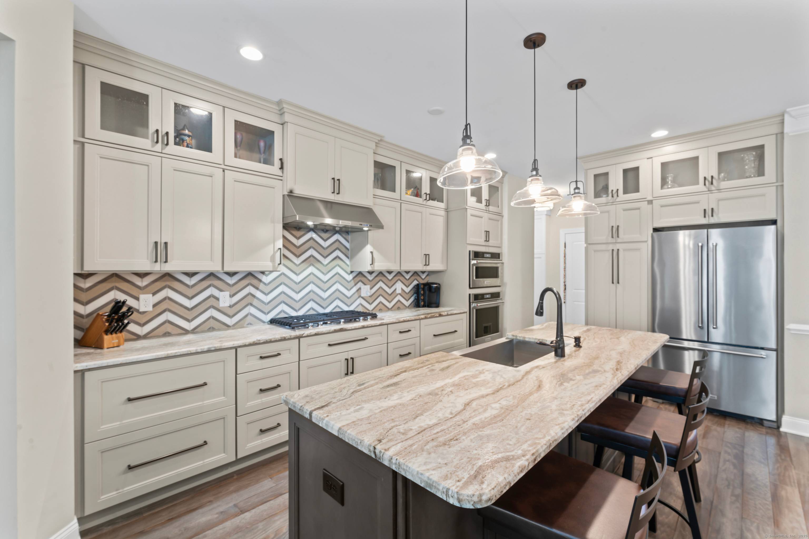 Welcome to 63 Great Hill Drive, a stunning townhome in The Summit at Bethel, a premier active adult luxury community with resort style amenities including pool and club house and ...