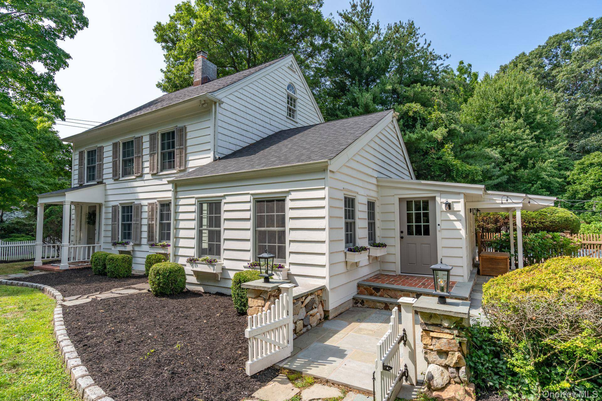 Picture perfect Cold Spring Harbor Colonial with additional 1400 sq ft of finished barn space.
