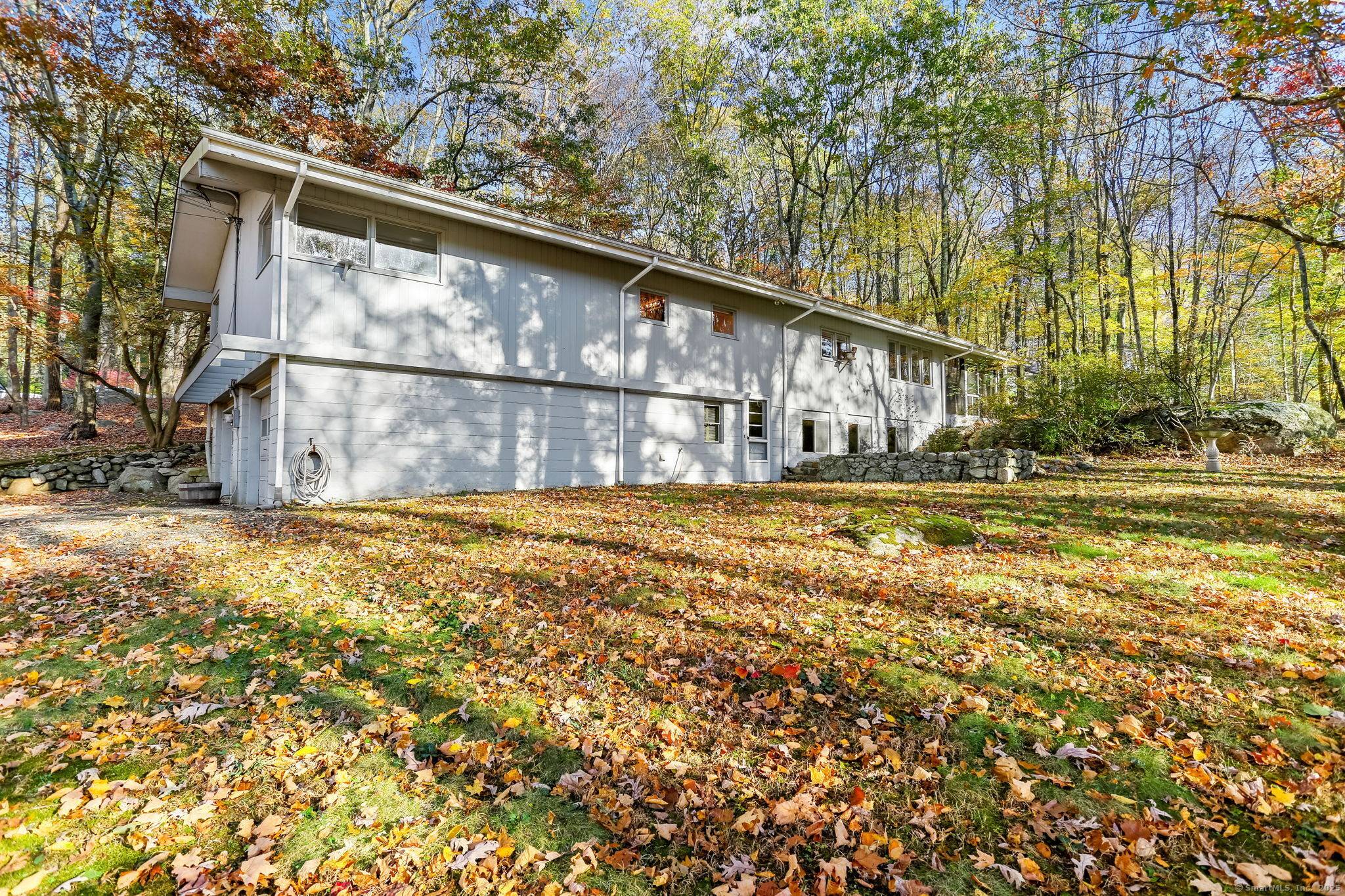Through a pillared entrance sited privately from the road discover a tremendous opportunity to own a one of a kind Fairfield home with style, light space for everyone inside out.