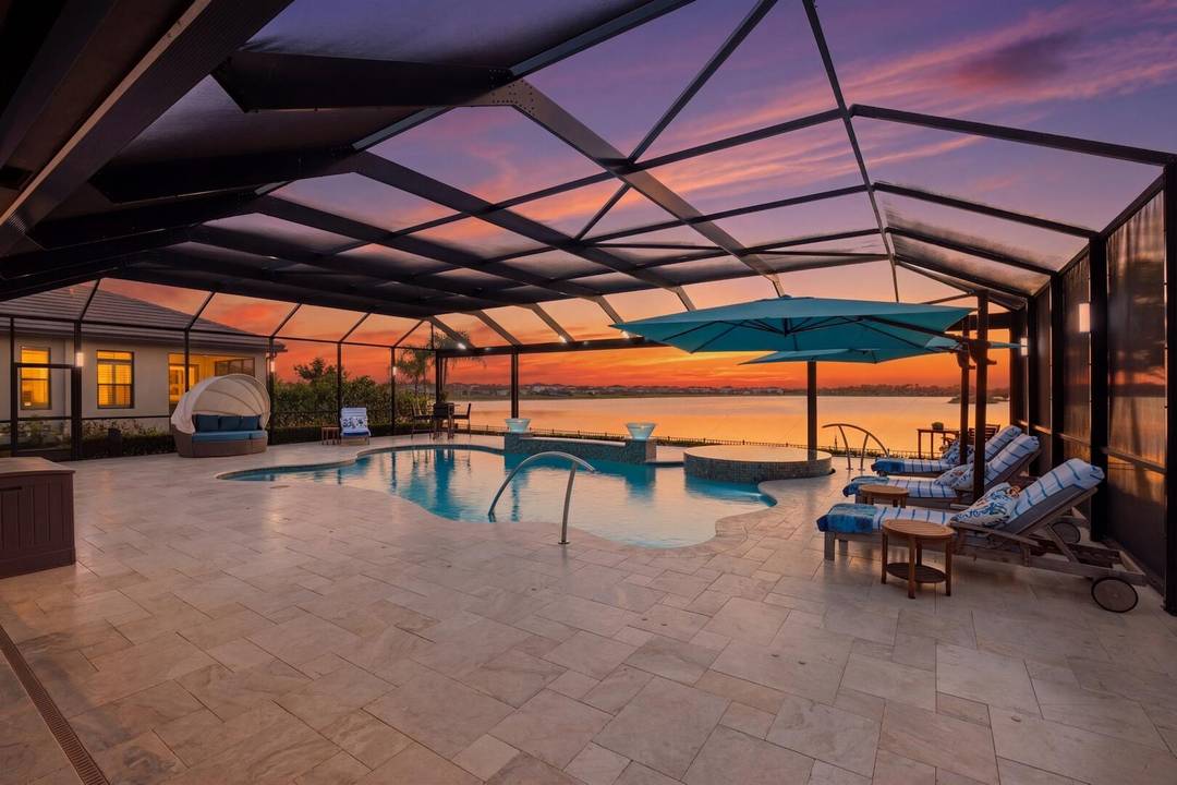 A stunning lakefront pool home designed with a clean, modern edge and elevated finishes throughout.