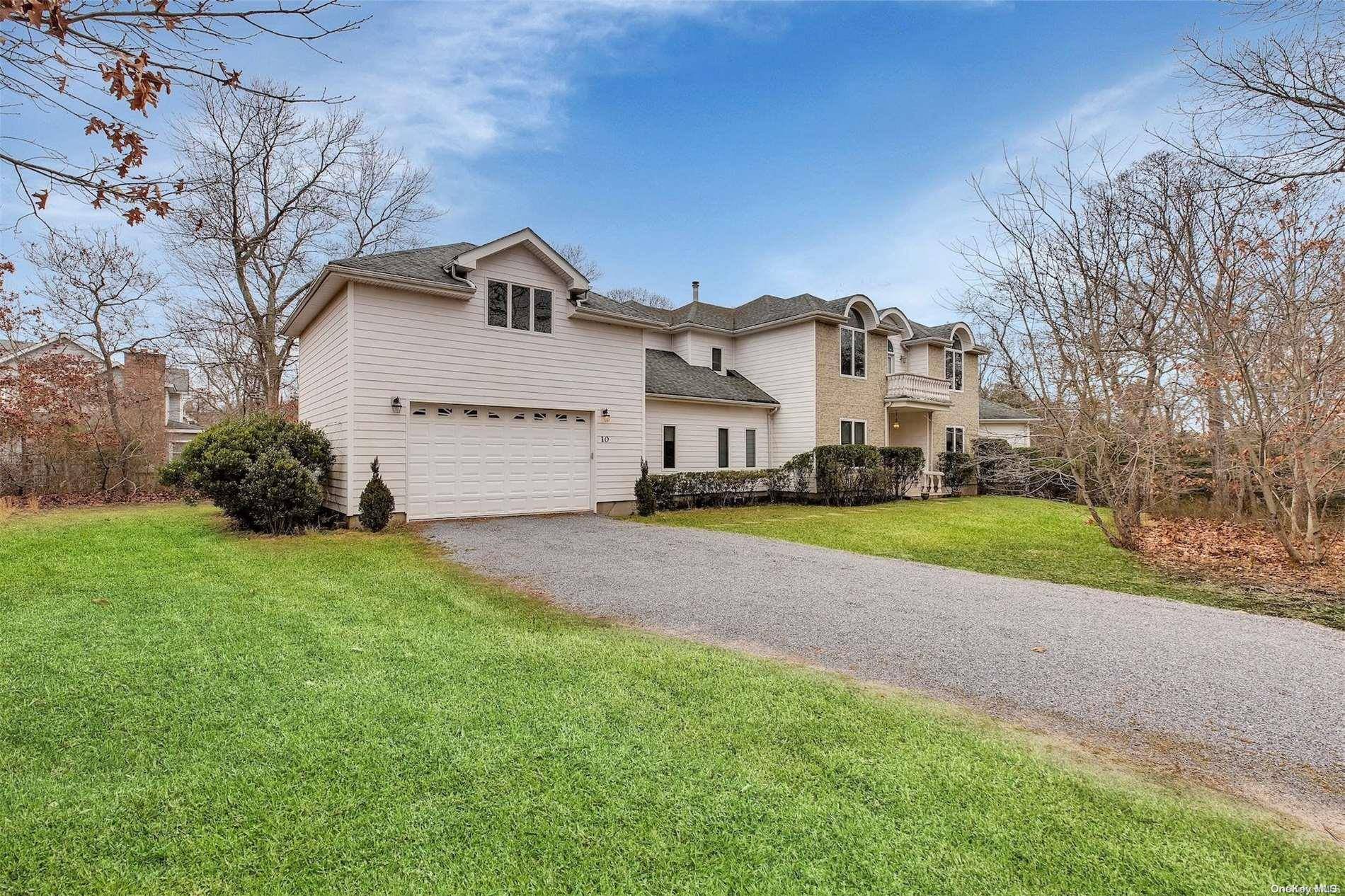 The open floor plan features a beautifully maintained interior that is awash with natural light and contains a formal dining room, large entertainment spaces, expansive great room, first floor bedroom, ...