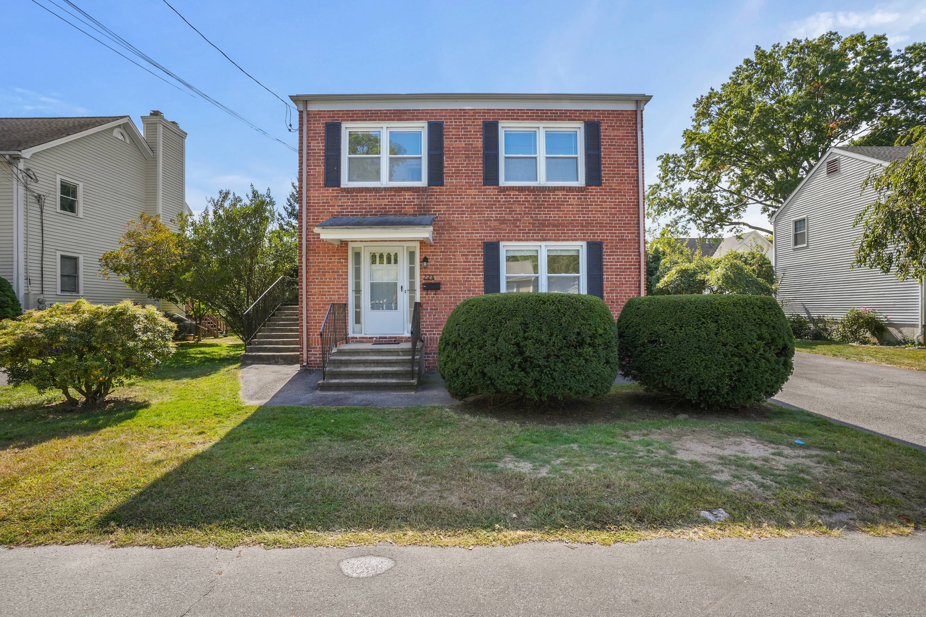 Beautifully maintained brick two family in Fairfield's sought after Holland Hill neighborhood.