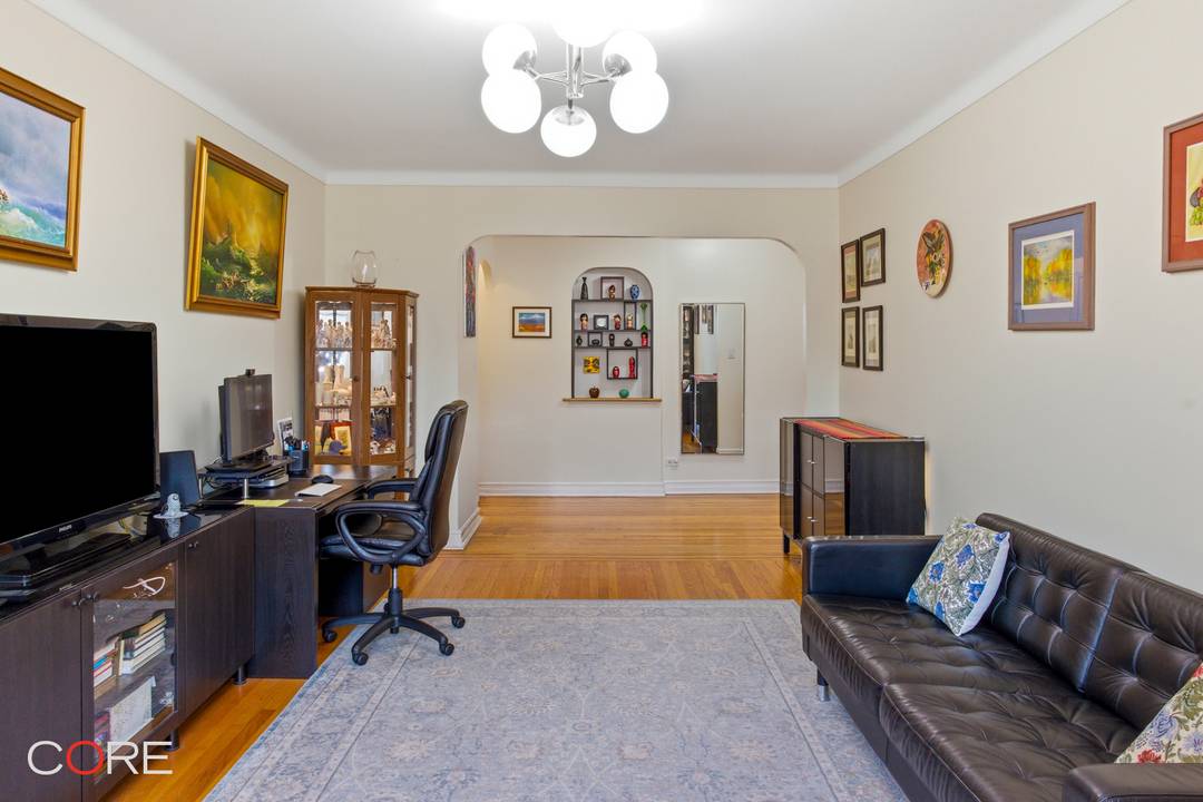 This expansive two bed, two bath top floor unit seamlessly blends classic pre war character, such as arched doorways and hardwood floors, with thoughtful updates, creating a warm and welcoming ...