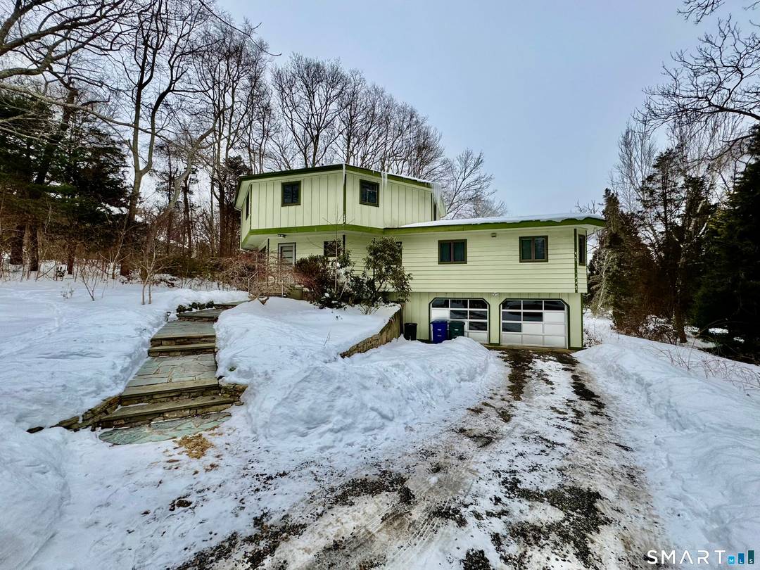 Quiet tranquil setting with tiered decks and slate patios to enjoy the sounds of nature.