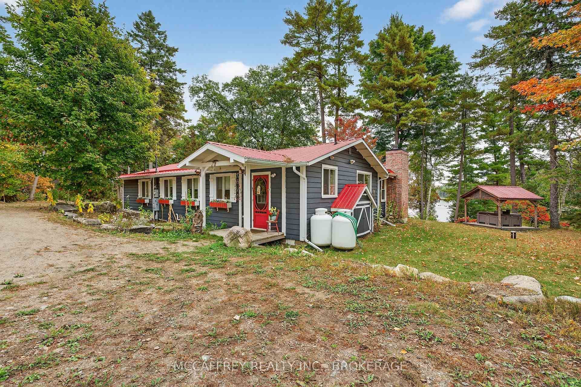 Welcome to your private lakeside retreat, a charming bungalow set on 11.