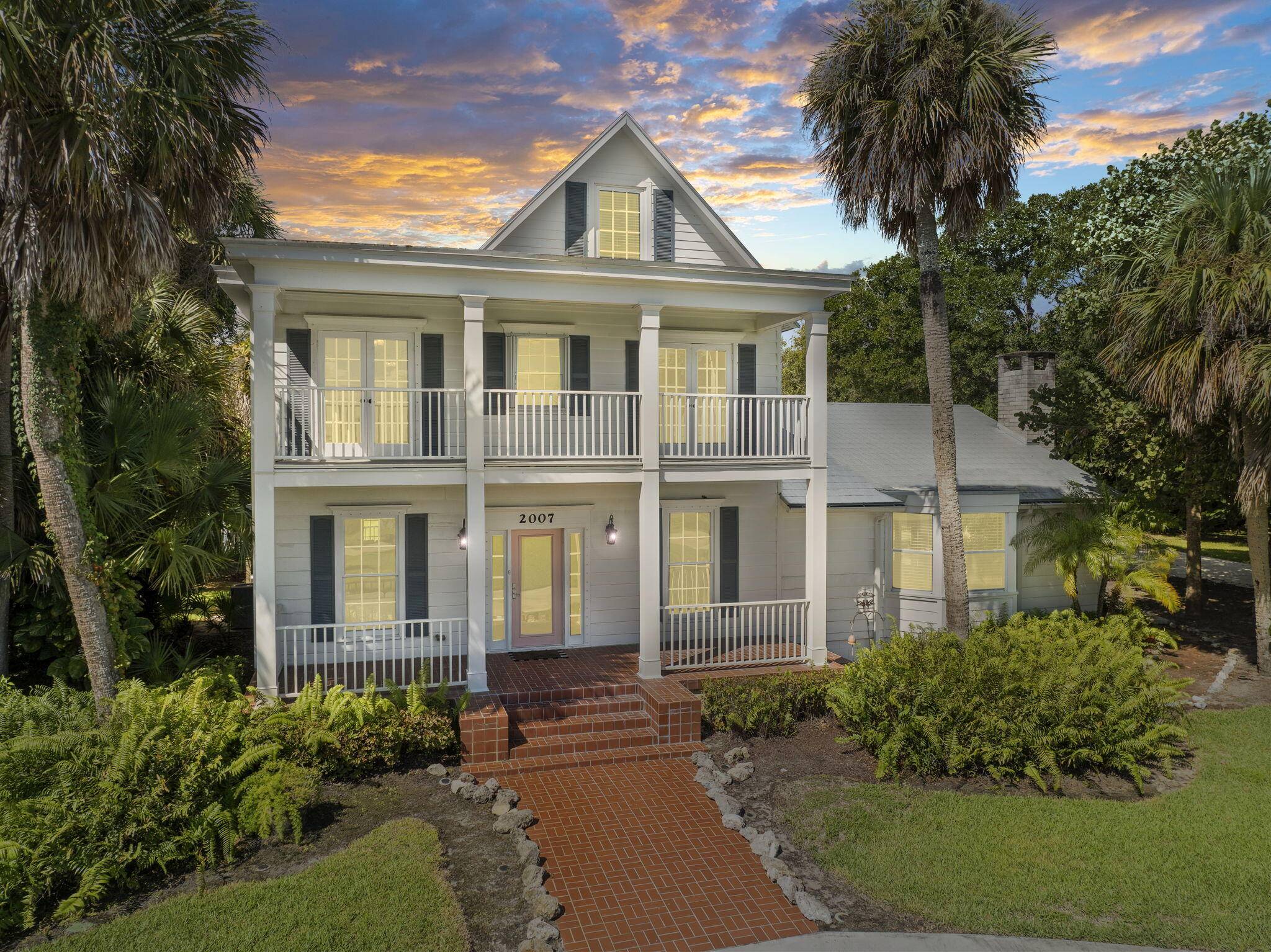 OLD FLORIDA LUXURY exemplified in this 1905 built Victorian estate, a rare jewel along Fort Pierce's scenic Indian River Drive.