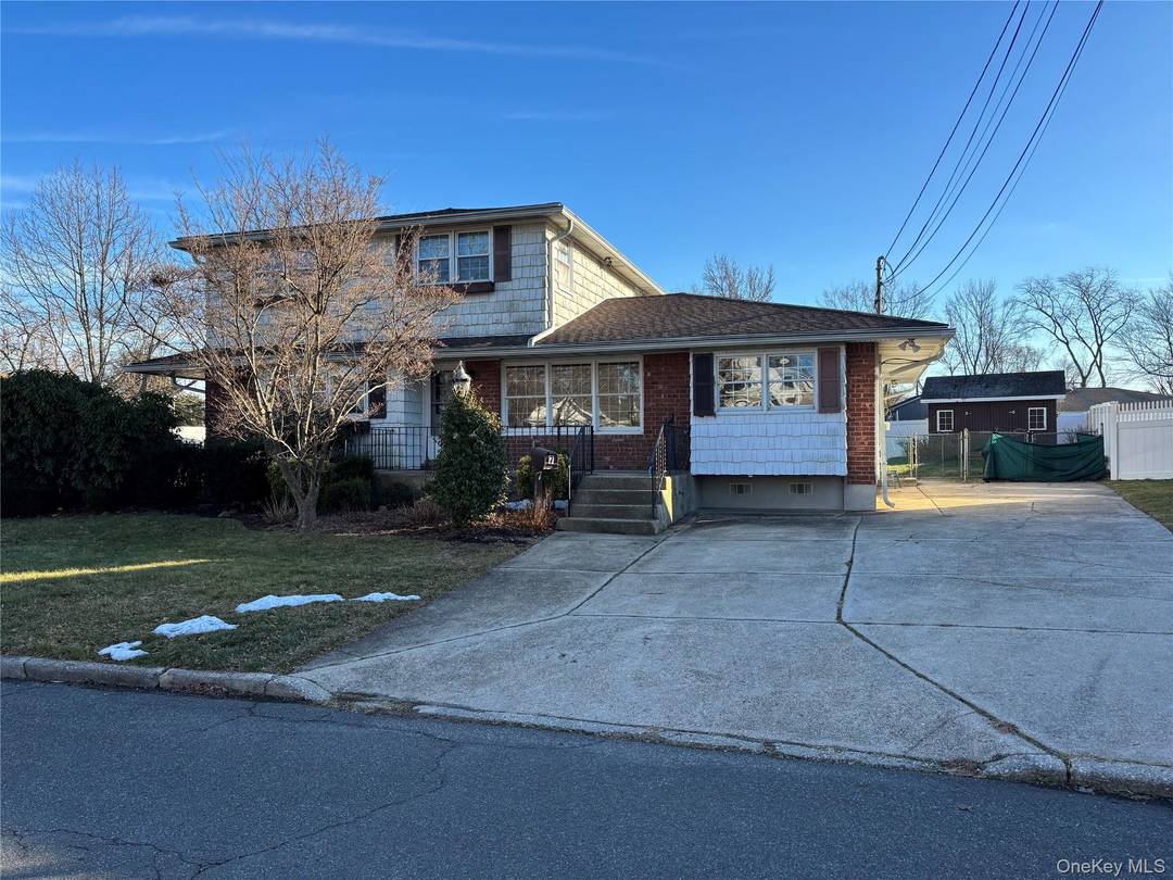 Spacious Colonial on a quiet, picturesque, tree lined street in Commack.