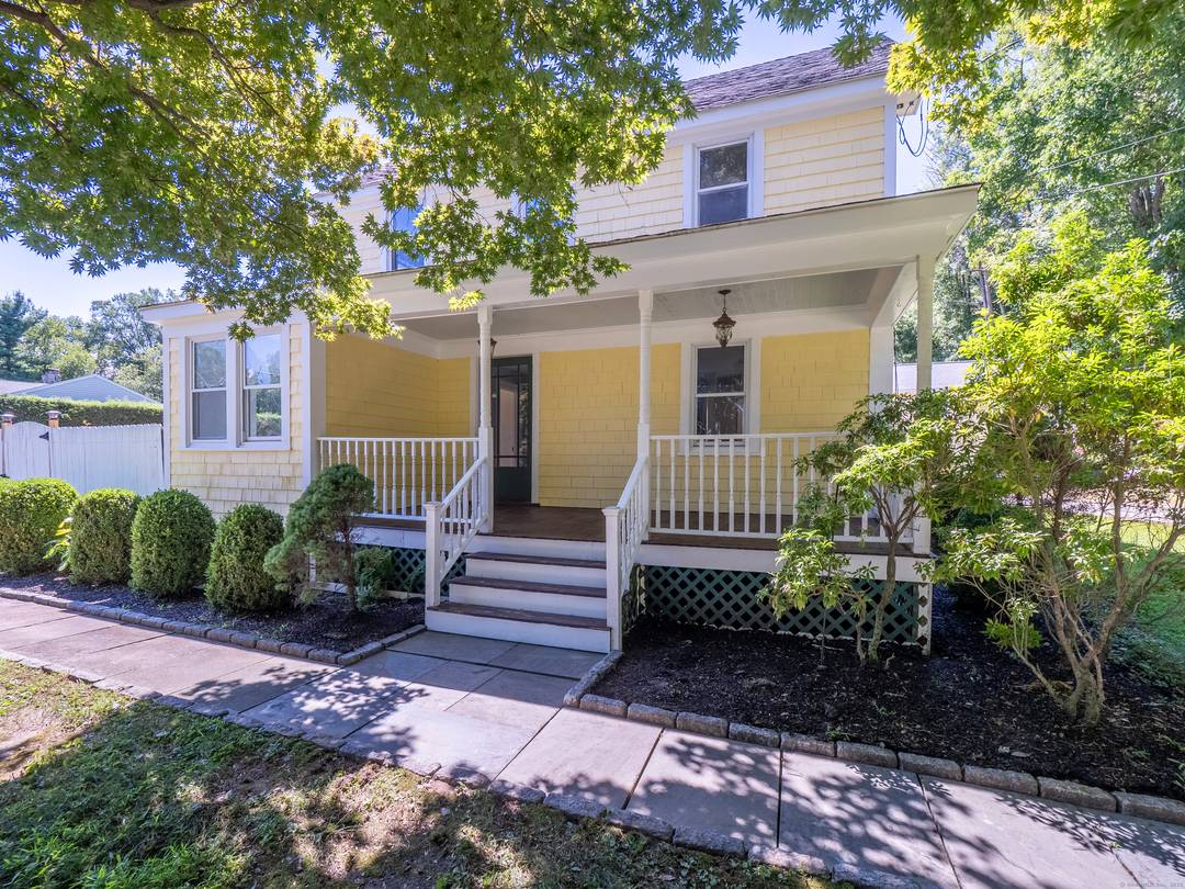 Set just moments from Ridgefield's town center, this classic farmhouse with a separate cottage offers a rare blend of charm, flexibility, and location.