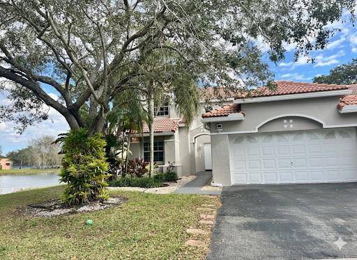 BEAUTIFULLY UPDATED RESIDENCE IN THE HIGHLY DESIRABLE HIBISCUS GATED COMMUNITY.